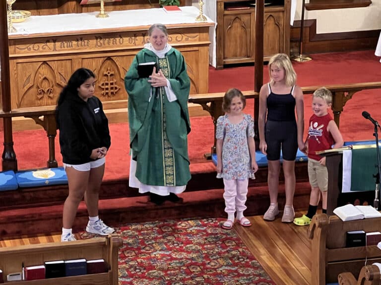 Rev Mary with young people from the church